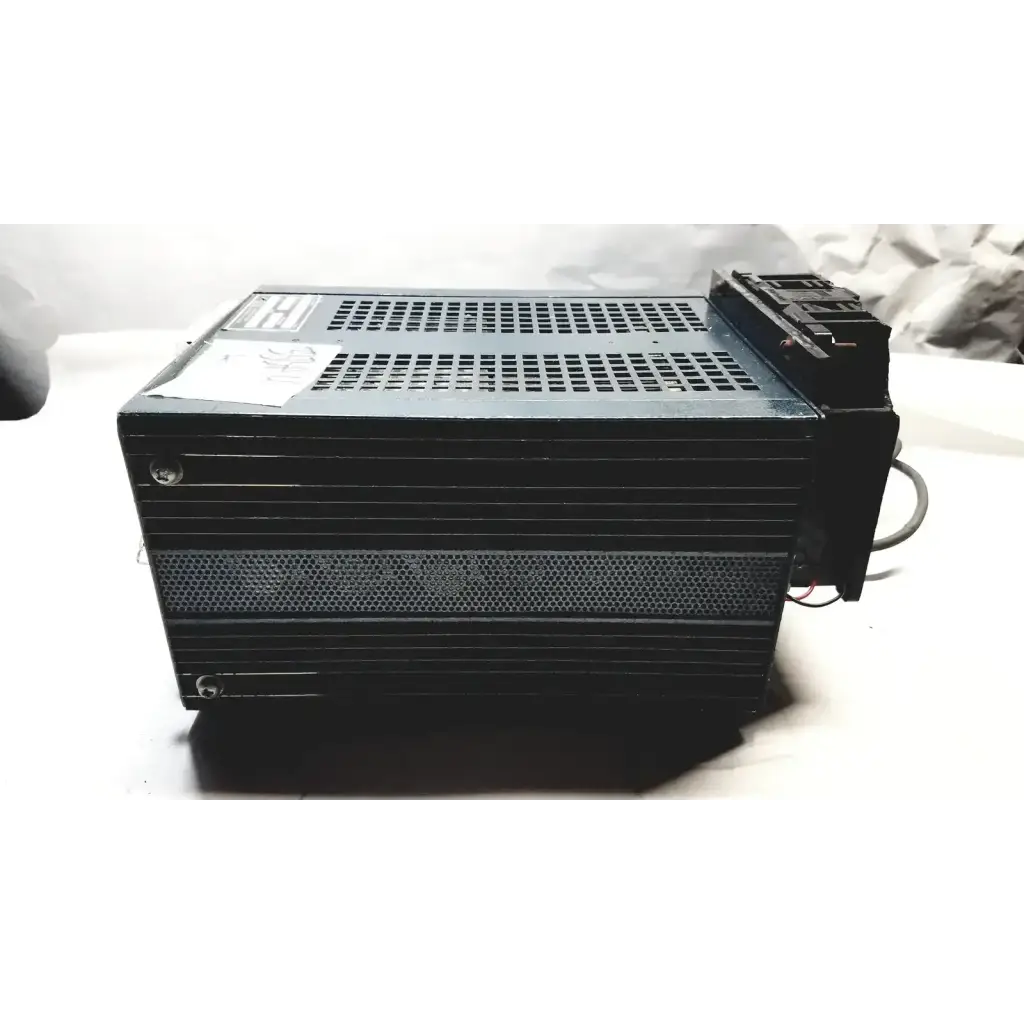 Black rectangular power supply with perforated metal casing and wiring for power mate corp 105-125v 47-20hz