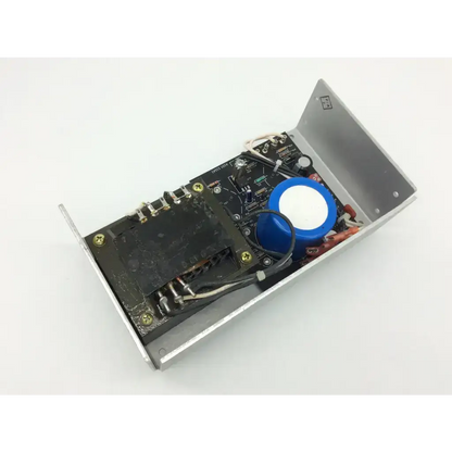Silver metal enclosure power supply 7224dkrmb19pr3 with black circuit board hd5-12 featuring capacitors and wiring