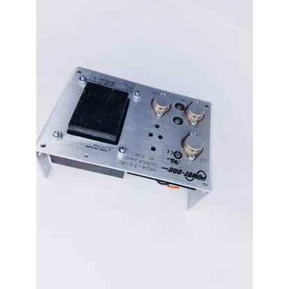 Silver aluminum power-one hn24-3 24vdc 3.6amps power supply unit with black component and brass knobs for nibp assembly board