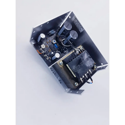 Black metal enclosure of power one hn24-3 24vdc 3.6amps power supply with capacitors and transformer housing nibp assembly board