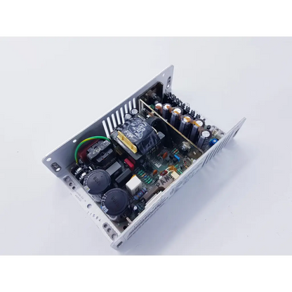 Silver metal power supply 80w with black capacitors and yellow transformer core on green circuit board for spacelabs mpc860 cpu