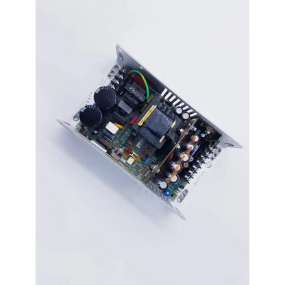 Silver metal power supply 80w with black capacitors and blue transformer for spacelabs mpc860 cpu on green circuit board