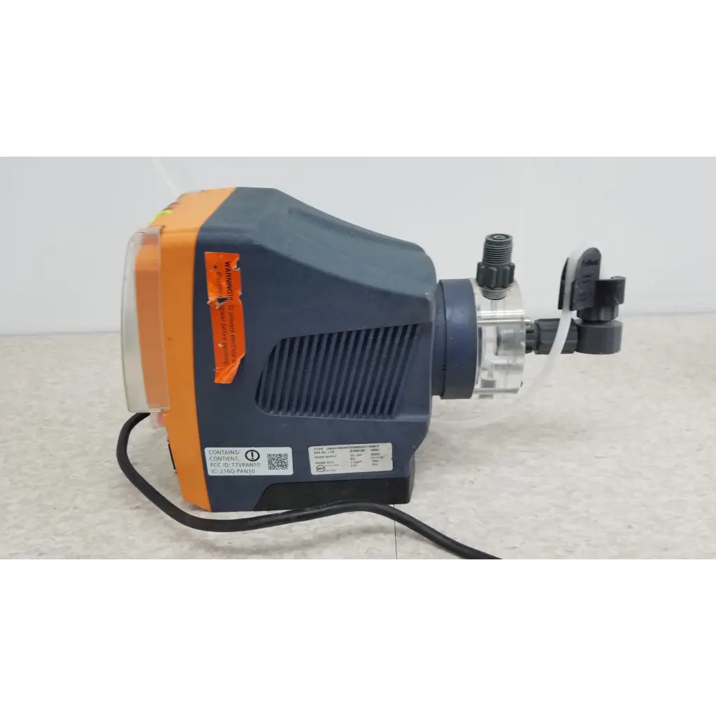 Blue and orange ProMinent Gamma X GMXA 1009 diaphragm metering pump with black fittings and transparent tubing assembly