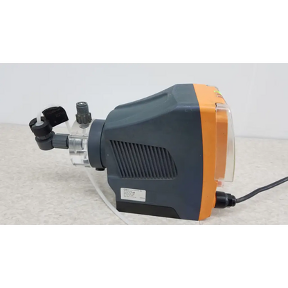 Gray and orange ProMinent gamma X GMXA 1009 diaphragm metering pump with transparent tubing for precise metering pump use