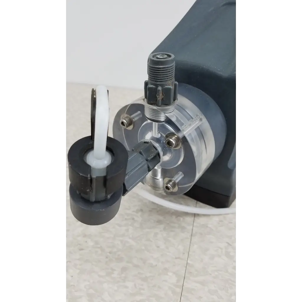 Black and silver prominent gamma x gmxa 1009 diaphragm metering pump with transparent tubing and threaded fittings