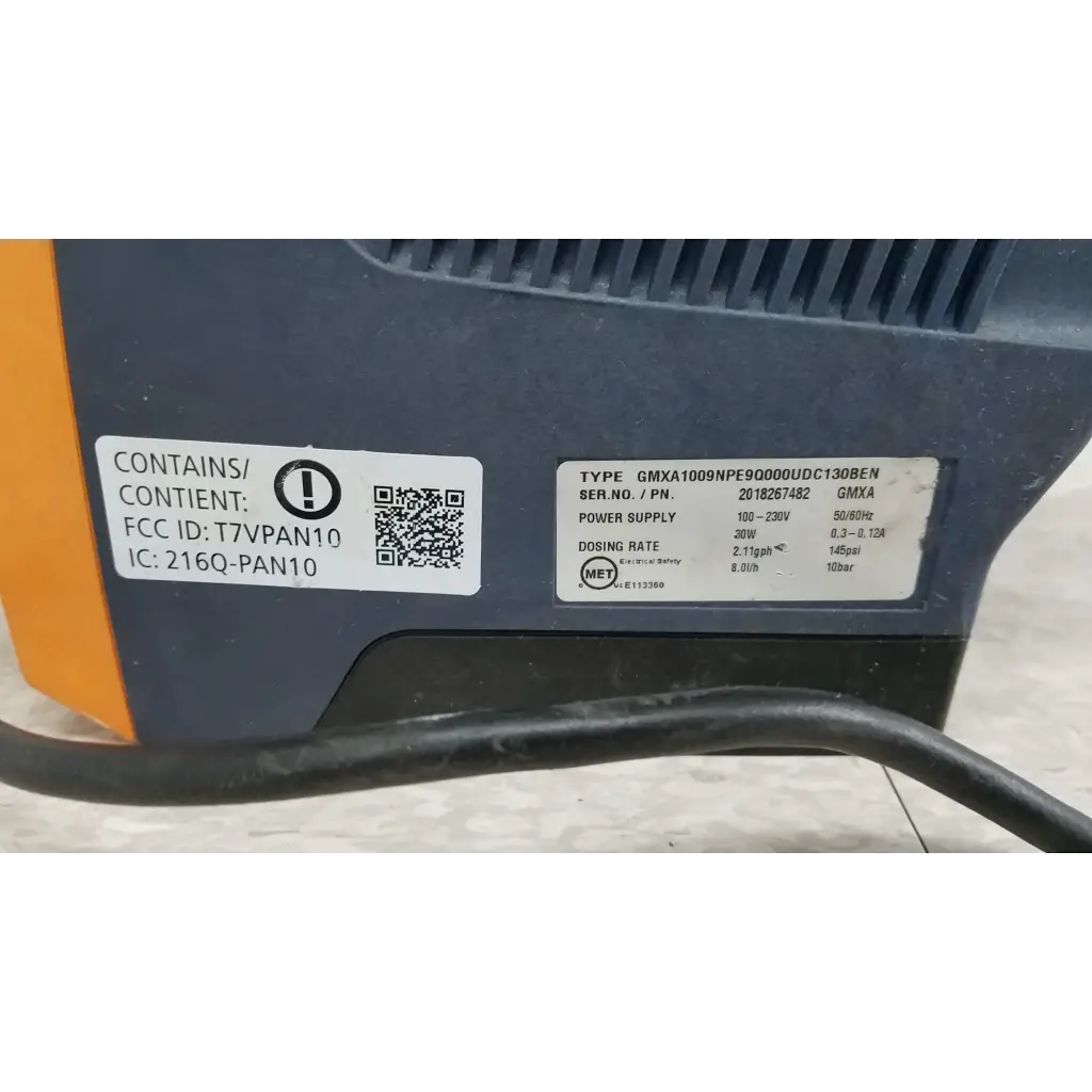 Black and orange ProMinent Gamma X GMXA 1009 solenoid diaphragm metering pump with technical specification labels
