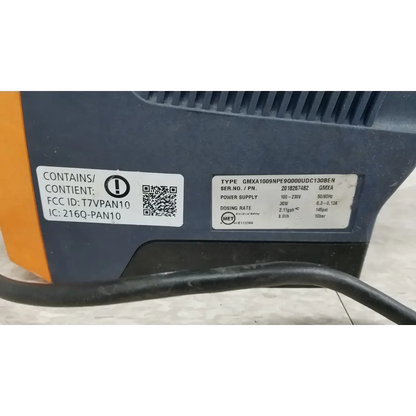 Black and orange ProMinent Gamma X GMXA 1009 solenoid diaphragm metering pump with technical specification labels