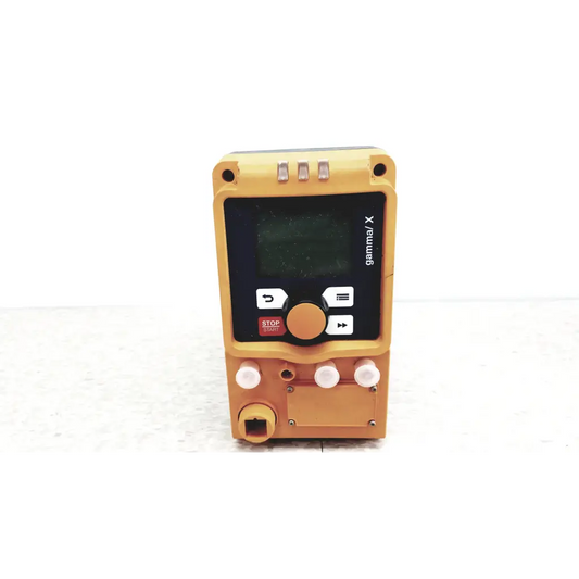 Yellow gamma x handheld industrial control device with black screen white buttons and orange dial for diaphragm metering pump