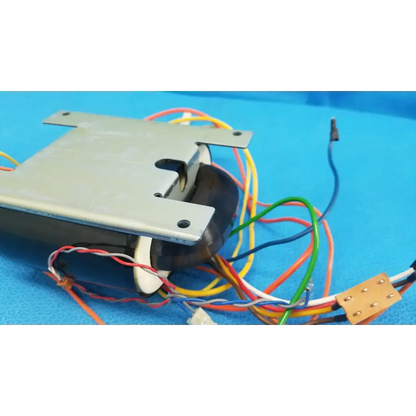 Metallic gray rectangular core power transformer with black cylindrical core and colored wires for retinal camera use