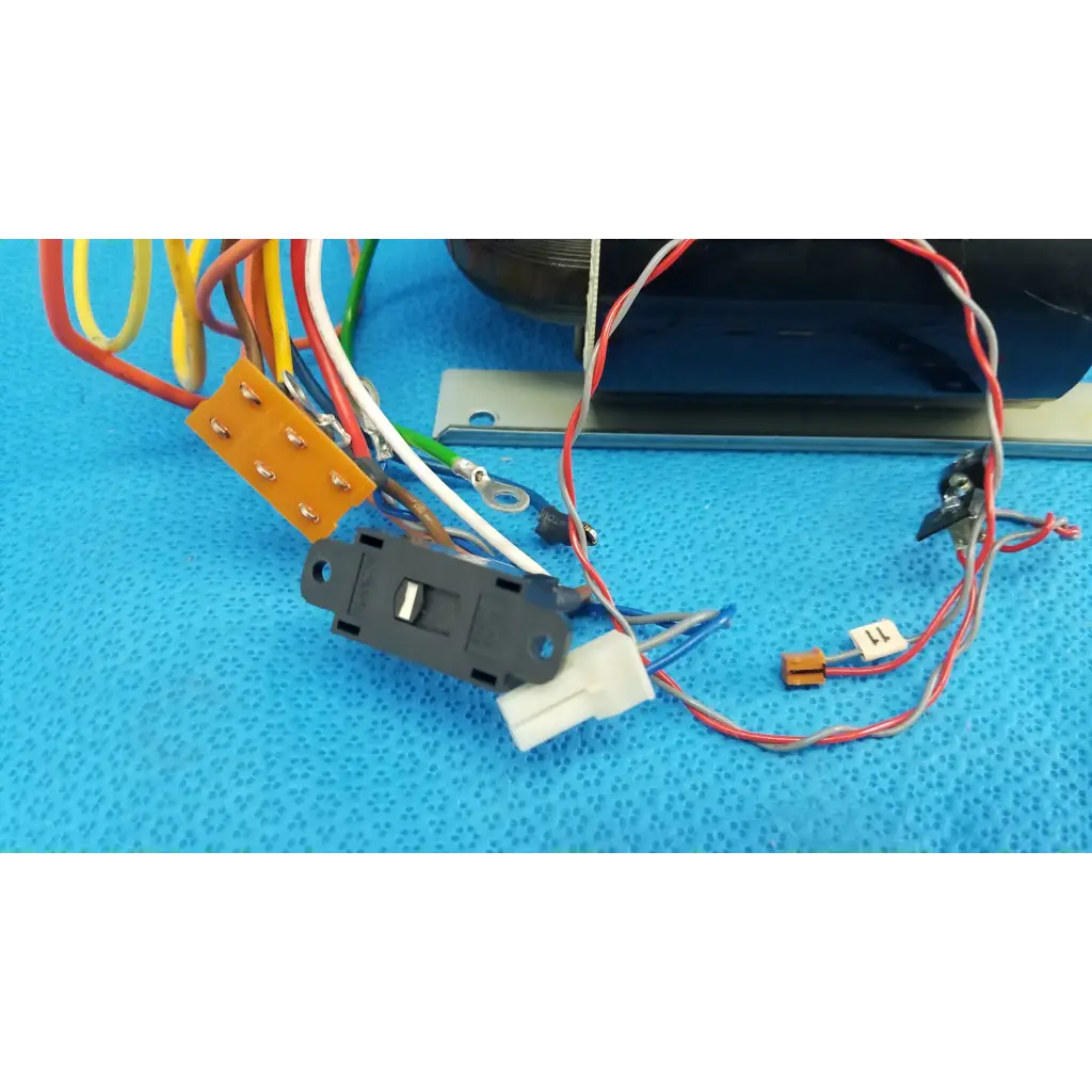 Black plastic toggle switch with colored wires connected to core power transformer for topcon retinal camera
