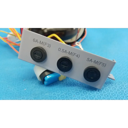 Gray electrical panel with three black switches on r core power transformer for topcon trc-nw6s retinal camera