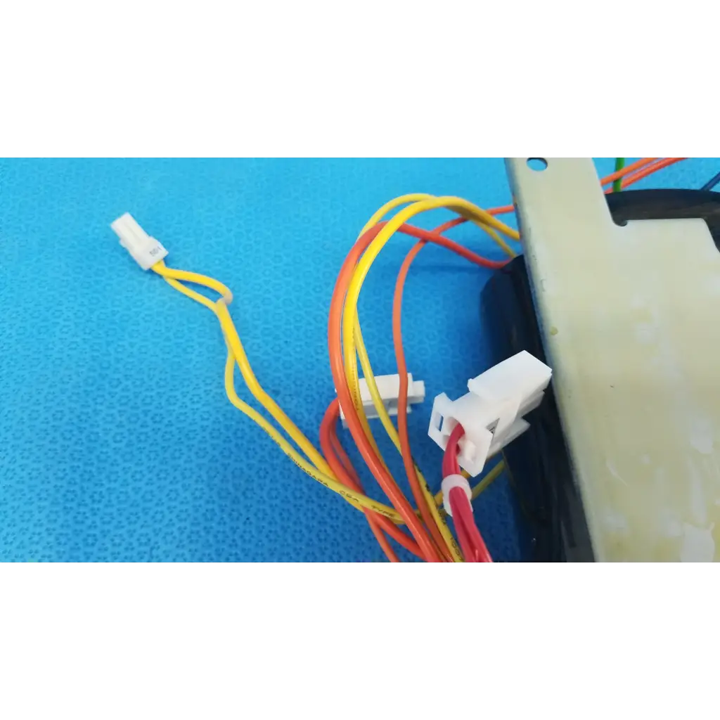 A bundle of colorful insulated wires with white plastic connectors for core power transformer in retinal camera