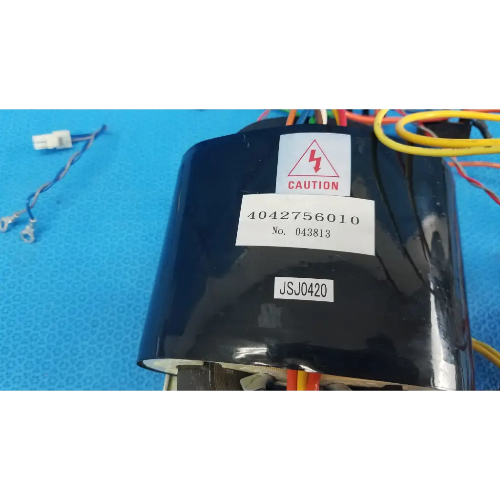 Black cylindrical core power transformer with colored wires and caution label for topcon trc-nw6s retinal camera