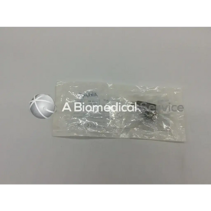 A silver rapid trauma single patient use laryngoscope blade with cross hatched pattern in clear alpha biomedical packaging