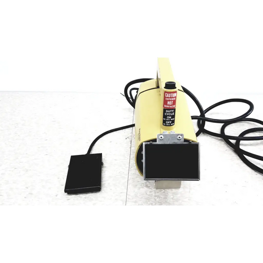 Raychem IR-550 yellow infrared heat shrink station with black foot pedal and warning label for heat shrink applications