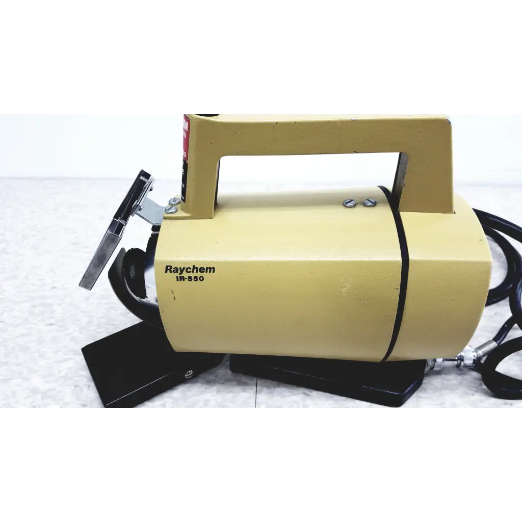 Yellow raychem ir-550 industrial handheld infrared heat shrink device with black handle and attached hoses for heat shrink station