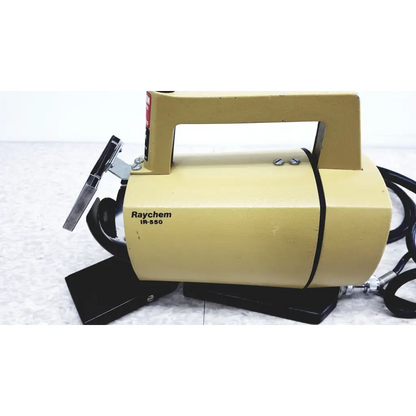 Yellow raychem ir-550 industrial handheld infrared heat shrink device with black handle and attached hoses for heat shrink station