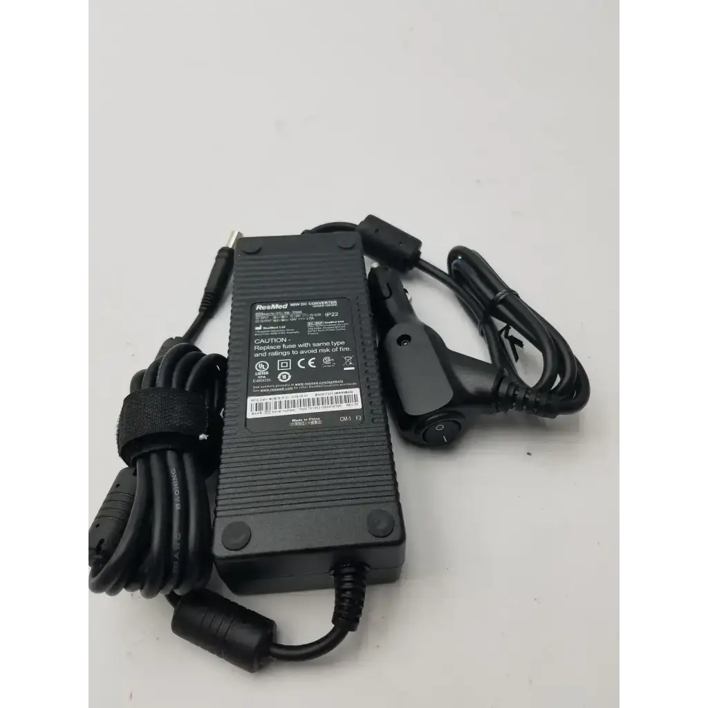 Black plastic resmed 90w dc adapter r370-7231 with coiled cables and car charger attachment for portable use