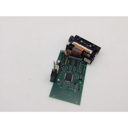 Rev b leica bbcd4-2 green printed circuit board with black components and small cylindrical sensor attached