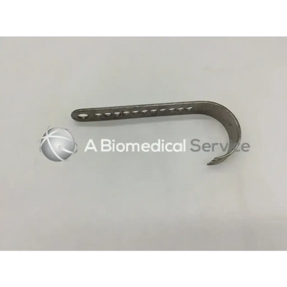 Silver metallic surgical plate with curved design and multiple holes for nephew deep blades self-retaining retractor