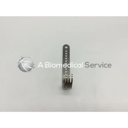 A sleek metallic nephew deep blade with circular holes and a curved spring end for self-retaining retractors
