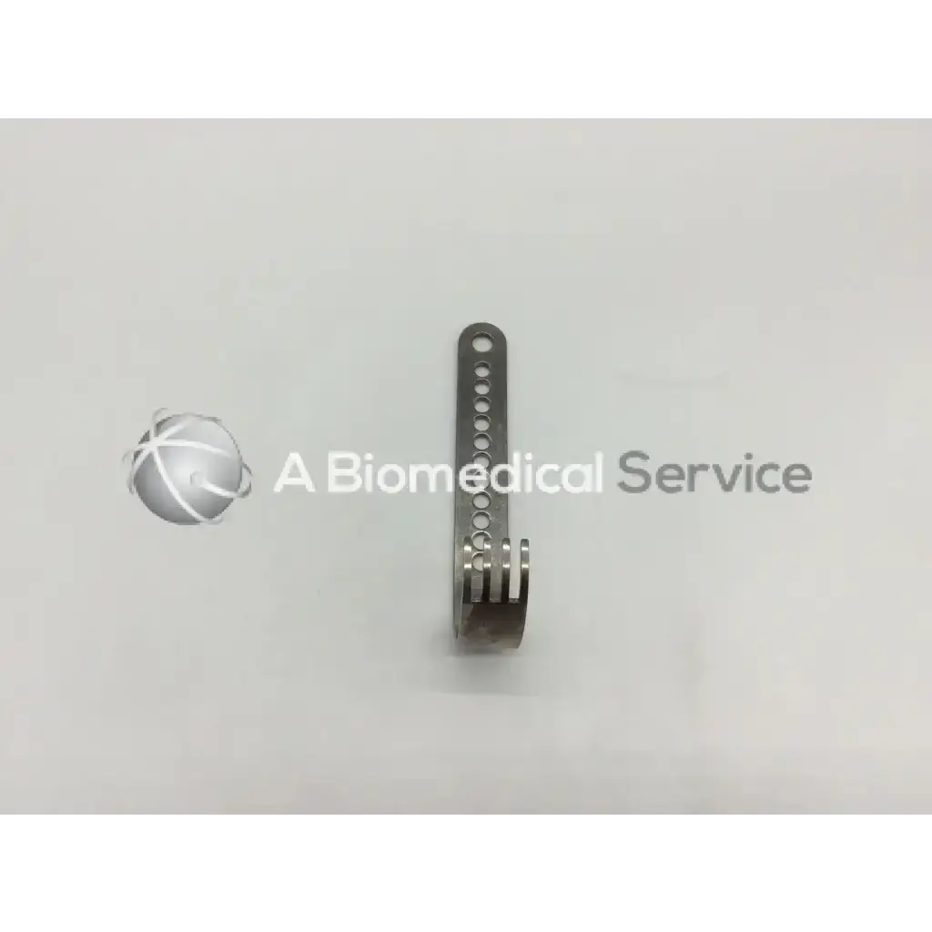 A sleek metallic nephew deep blade with circular holes and a curved spring end for self-retaining retractor use
