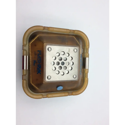 Brown plastic housing with silver perforated metal plate and screws on the back of riley medical flag pak 9020 sterilizer