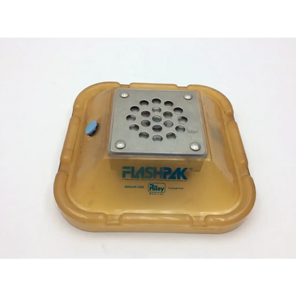 Yellow plastic flushpak moisture absorber with silver perforated metal lid and blue cap for riley medical flag pak sterilizer