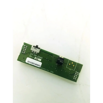 Green rectangular circuit board bbcb3-10a with silver solder points black integrated components and serial number label s/n09046850