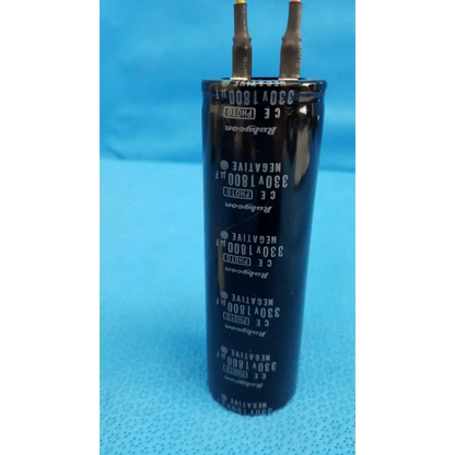 Black cylindrical rubycon photo capacitor 330v 1800uf with silver lettering and two metallic terminals for trc-nw6s retinal camera