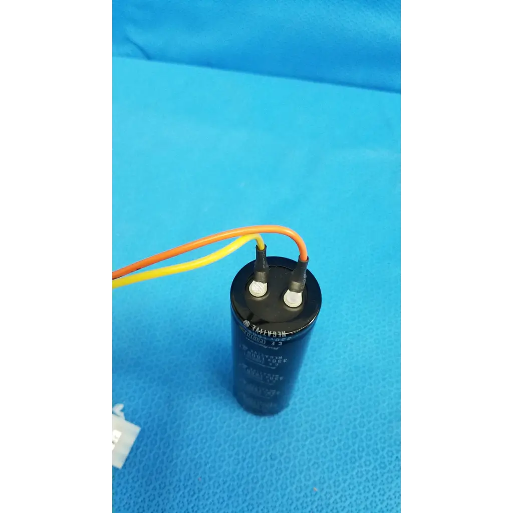 Black cylindrical rubycon photo capacitor 330v 1800uf with terminals and orange-yellow wires for trc-nw6s retinal camera