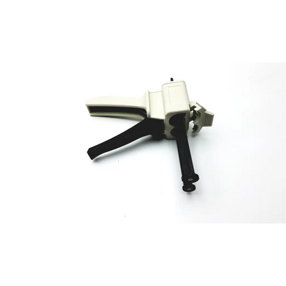 Black and off-white s-50 cartridge impression gun with textured grip for ergonomic use with impression material cartridges