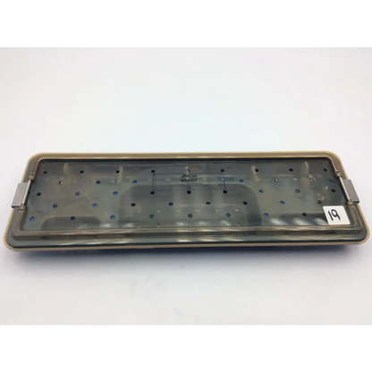 Rectangular acmi mra-gt telescope surgical instrument tray with translucent gray plastic interior and metallic side handles