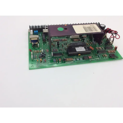 Green printed circuit board saf162e f146 fa162c with black integrated circuits resistors capacitors and purple heat sink