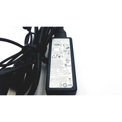 Black plastic samsung a12-040n1a adapter laptop charger with coiled cable and white regulatory label on back side