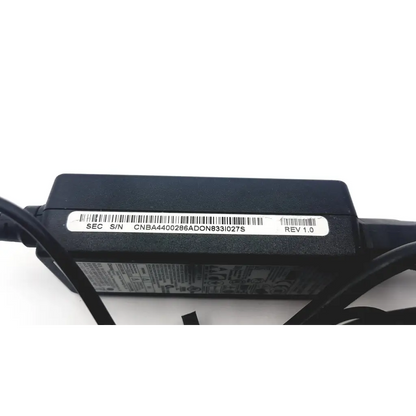 Black plastic samsung a12-040n1a adapter laptop charger showing back side with barcode label and serial number