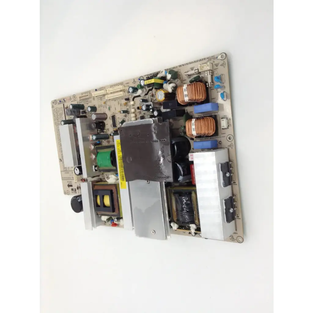 Beige samsung pspf501a01a power supply board with copper coils capacitors and metal heat sinks for reliable power management
