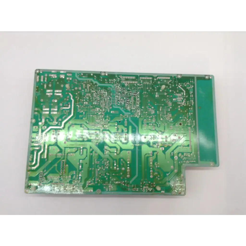Green rectangular printed circuit board with silver traces and soldered pads for samsung pspf501a01a power supply board