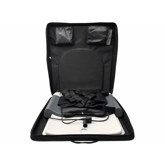 Black carrying case with white and gray inflatable lumbar traction device and power cord for at-home use by Saunders