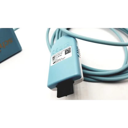 Light blue plastic schick elite sirona replacement cable with black plug and coiled teal cord for dental devices