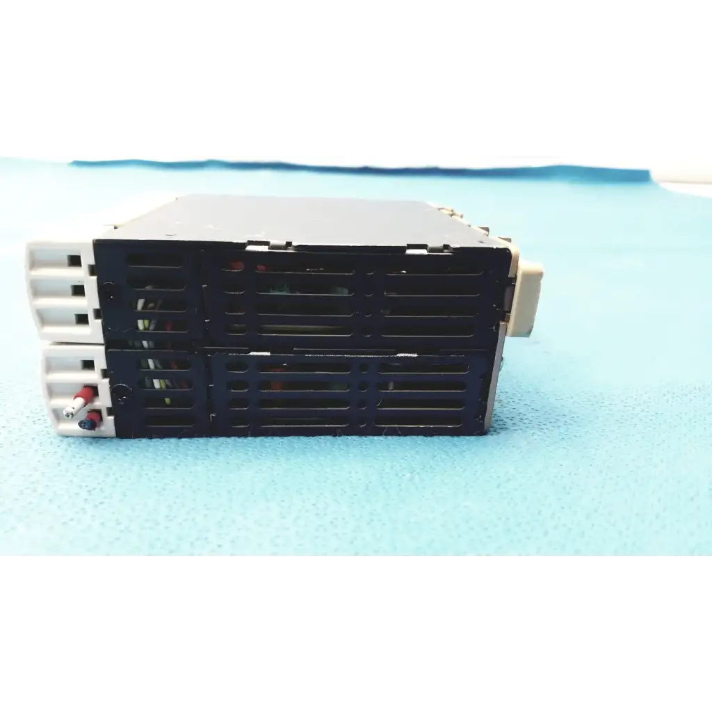 Black and white schneider electric abl7 rp1205 switch mode din rail panel mount power supply with vented front panel and wiring