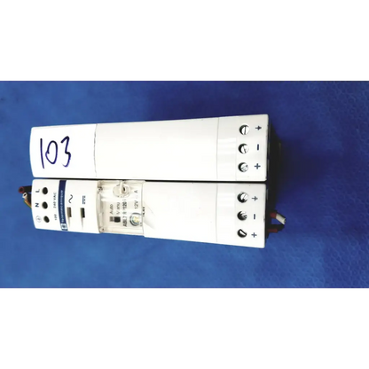 White rectangular schneider electric abl7 rp1205 switch mode power supply with labeled terminals and indicator lights