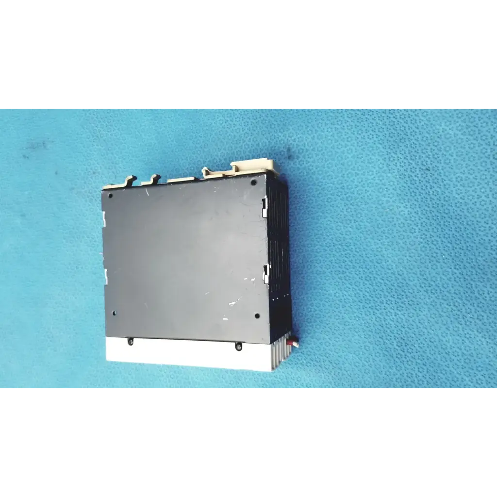 Black and white schneider electric abl7 rp1205 switch mode power supply with ribbed heat sink for din rail mounting