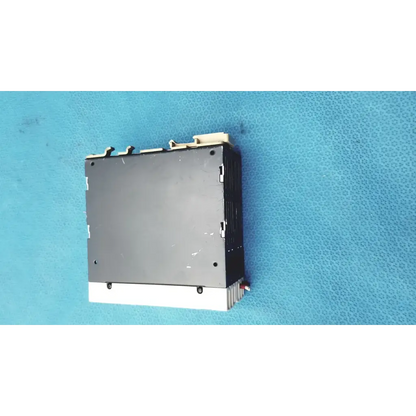 Black and white schneider electric abl7 rp1205 switch mode power supply with ribbed heat sink for din rail mounting