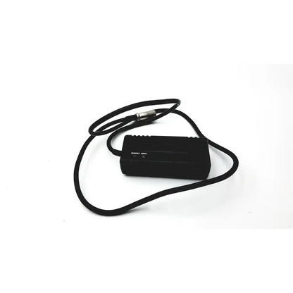 Black rectangular scooter power wheelchair battery charger with coiled black cable and metallic connector for 24v 2a power supply