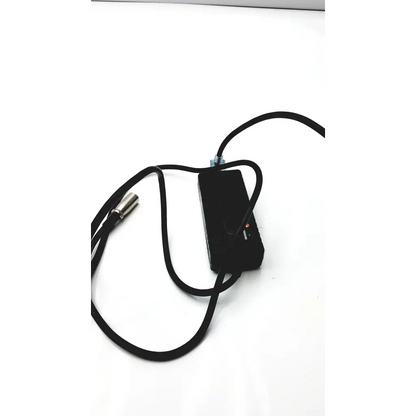 Black rectangular scooter power wheelchair battery charger with coiled black cable and silver xlr connector