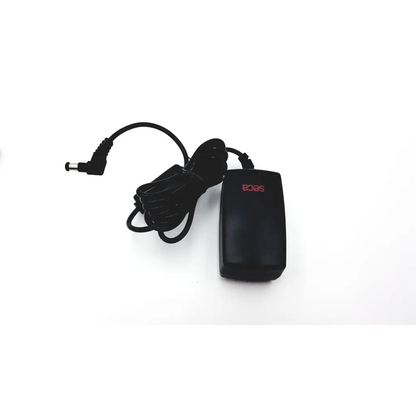 Black plastic seca medical power supply with red acer logo, coiled power cord, and cylindrical connector for medical use