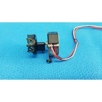 Black seiko epson stepper motor with multi-colored wiring and metallic parts for internal shutter in retinal camera