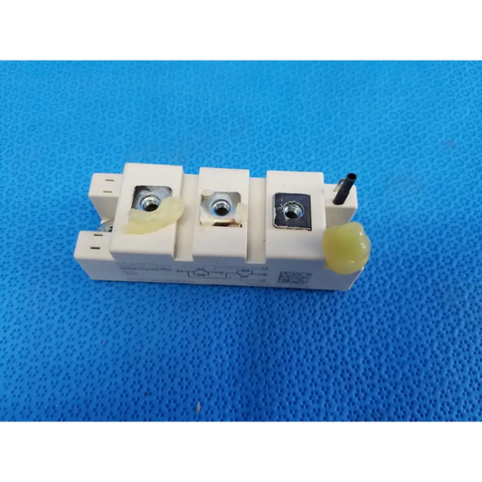 Semikron skm195gb066d white rectangular igbt power module with three threaded terminals and yellow insulating caps
