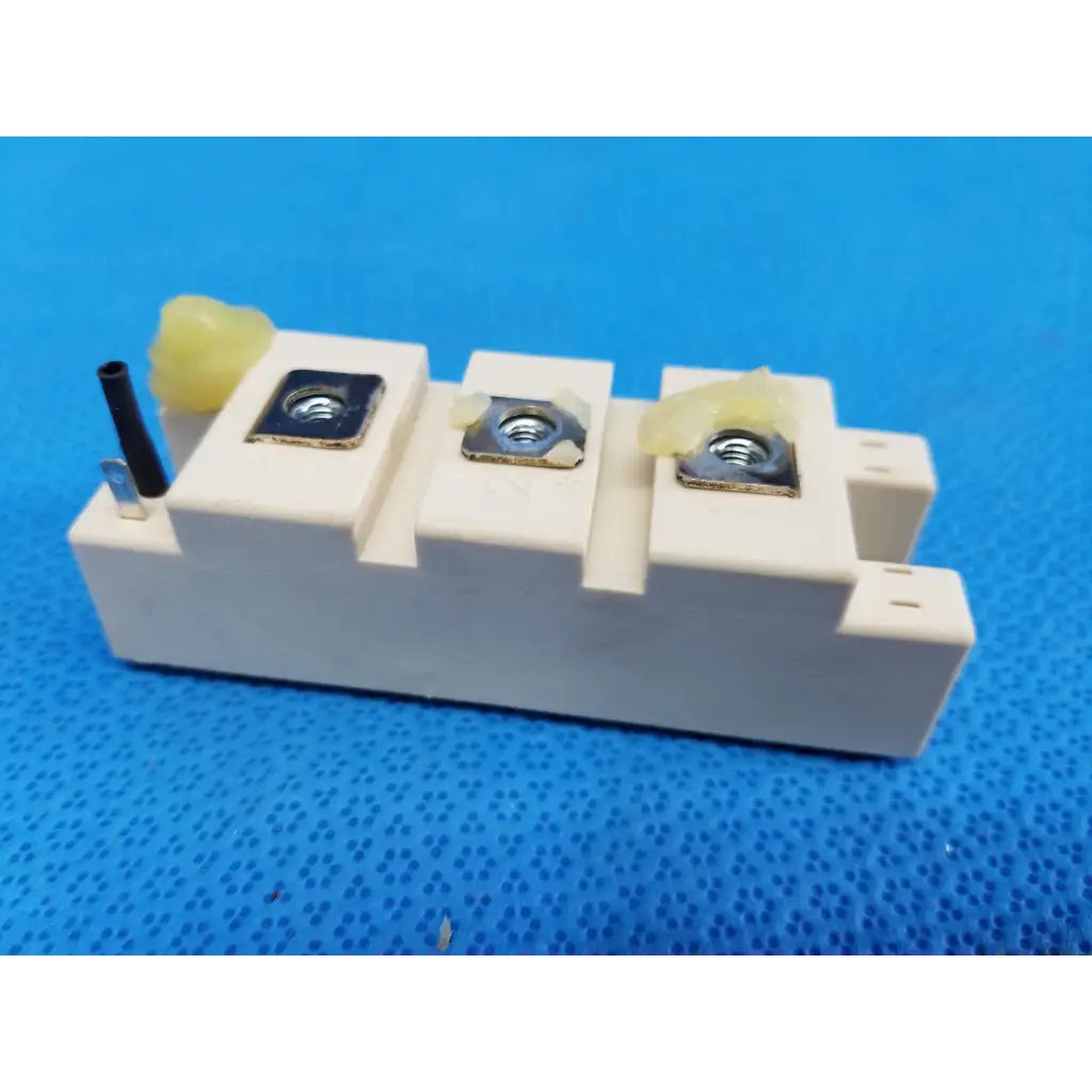Semikron SKM195GB066D white ceramic igbt power module with three metallic terminal screws and black insulated wire